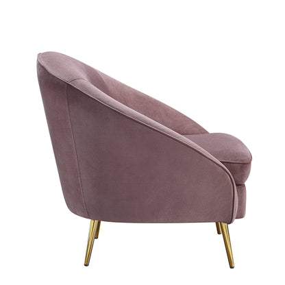 Side view of mauve velvet accent chair with a curved silhouette and sloping armrest, designed with shiny gold metal tapered legs.