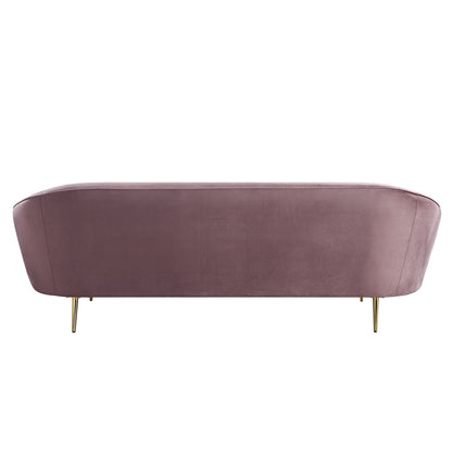 Rare view of mauve velvet sofa with a curved silhouette and sloping armrest, designed with shiny gold metal tapered legs.