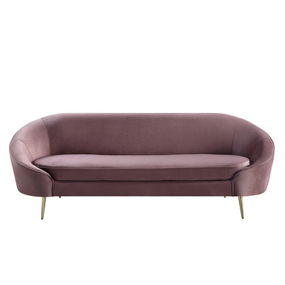 Front view of mauve velvet sofa with a curved silhouette and sloping armrest, designed with shiny gold metal tapered legs.