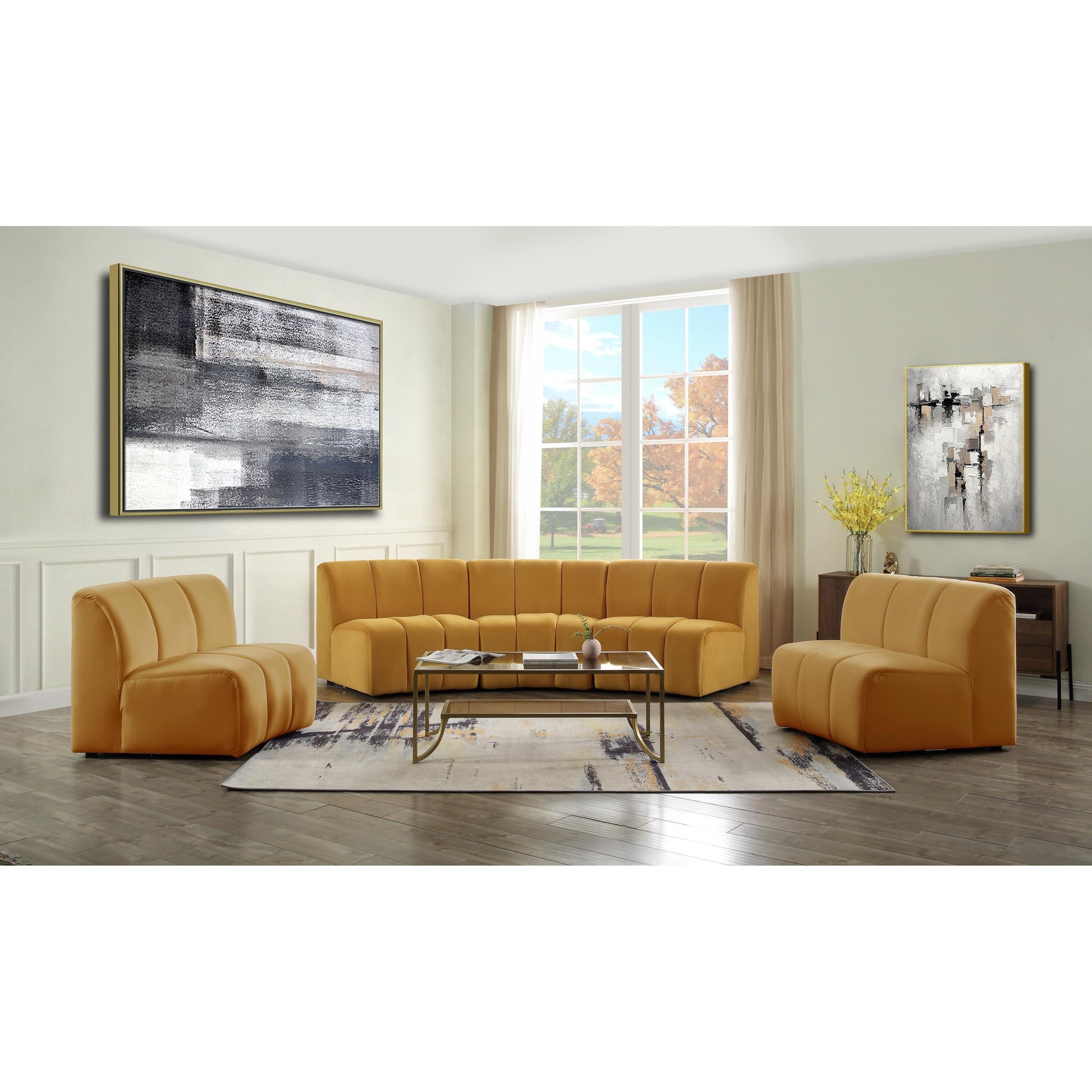 Felicia Modular Sectional Sofa shown in decorated living room. Sofa Sofa features a mustard yellow velvet upholstery, with vertical channel tufting.