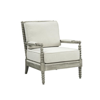 Jordan Accent Chair has beige linen upholstry cushions with a gray oak finish frame. The frame has an intricate bubble detailing along the arms, legs and back of the accent chair. 