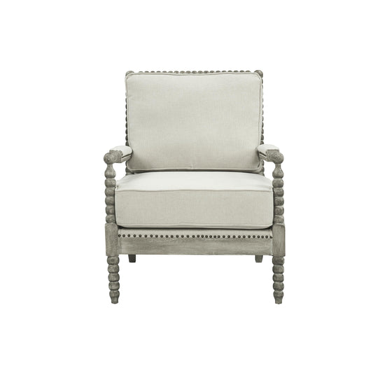 Jordan Accent Chair has beige linen upholstry cushions with a gray oak finish frame. The frame has an intricate bubble detailing along the arms, legs and back of the accent chair. 