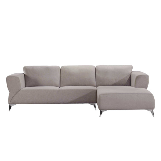 Light tan sectional sofa with right side chaise. The sectional sofa has chrome metal legs.