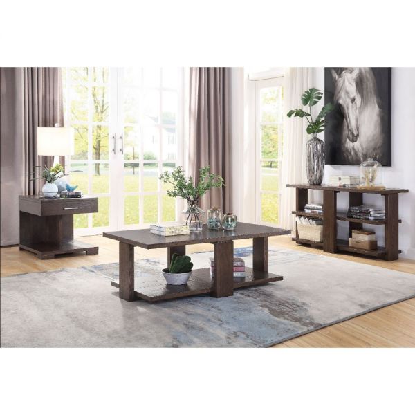 Niamey living room table collection shown together in a decorated living room. The collection includes an end table, an accent table, and a coffee table. Each piece has a rich walnut finish.