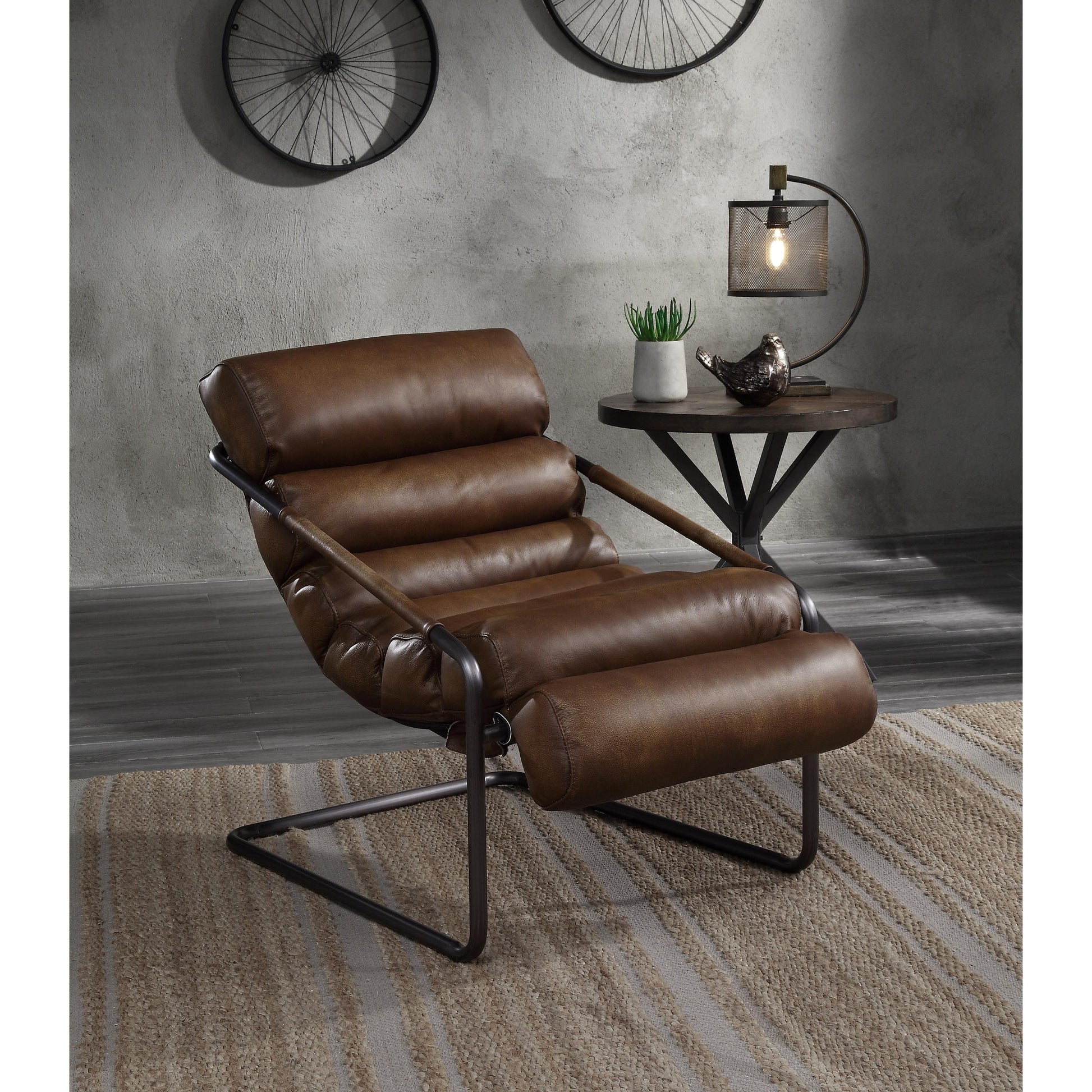 Brown leather accent chair with matte iron framing. Accent chair is detailed with horizontal tufting. The accent chair has a slight recline.